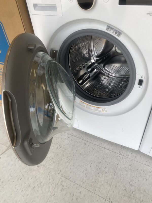 LG 5.0 cu. ft. Stackable Smart Front Load Washer washing lavadora clothes in White